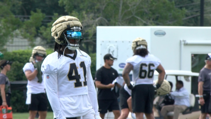 Alvin Kamara stands on the practice field during Saints training camp on July 26, 2023.